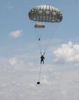 U.S. Army Reserve paratroopers with the U.S. Army Civil Affairs and Psychological Operations Command (Airborne) navigate to a landing during nontactical airborne operations at Saint Mere Eglise drop zone, Fort Bragg, N.C., June 5, 2021. USACAPOC(A) jumpmasters worked with Capt. Ignacio Rios, a Chilean jumpmaster assigned to the 1st Special Warfare Training Group(A), U.S. Army John F. Kennedy Special Warfare Center and School (USAJFKSWCS). Paratroopers jumping during the airborne operations were eligible to earn foreign wings.