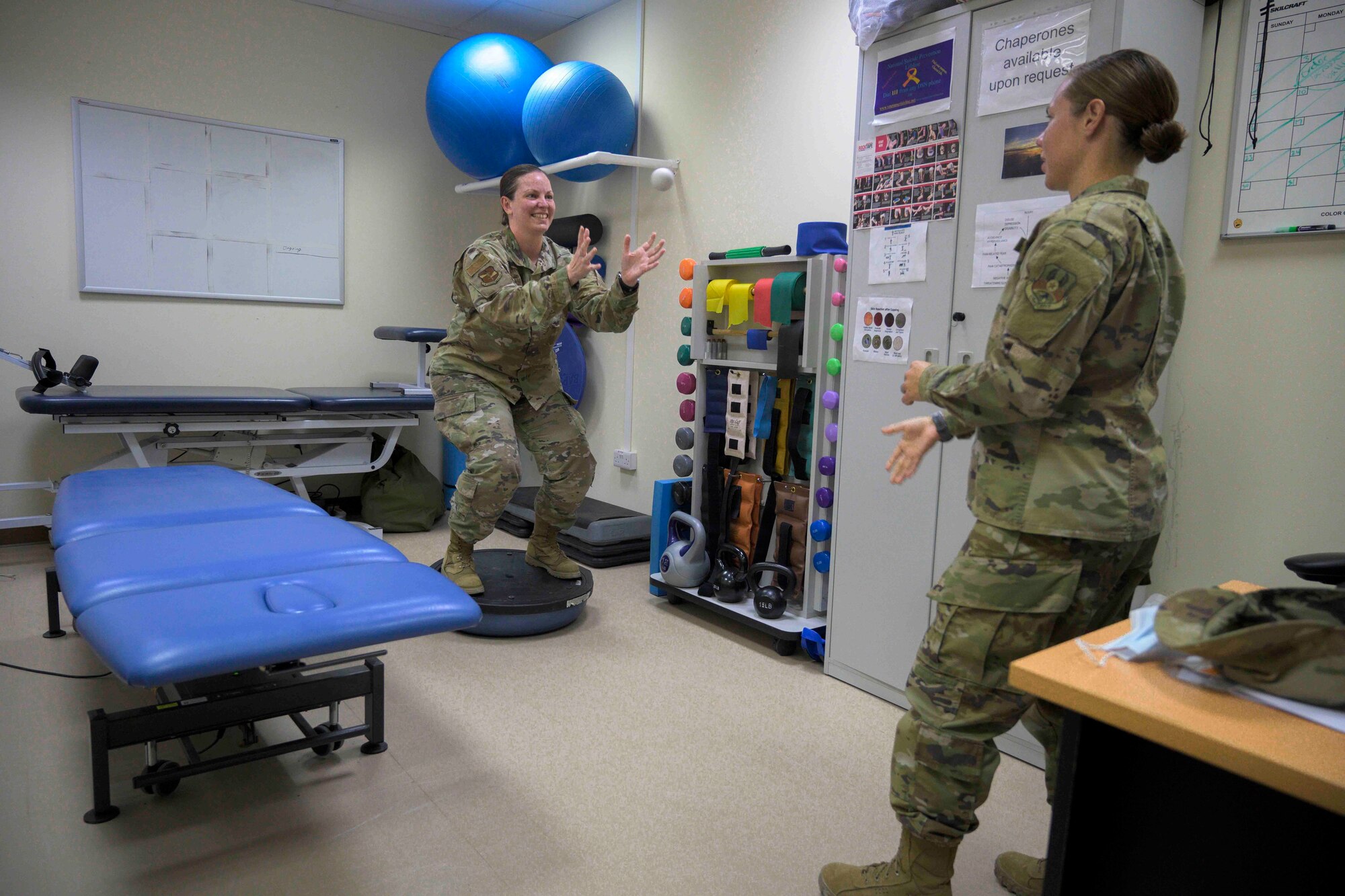 Physical therapists from the 380th Expeditionary Medical Group demonstrate common exercises used during physical therapy sessions, Al Dhafra Air Base (ADAB), United Arab Emirates, May 26, 2021. Physical therapy services are available at ADAB and include but are not limited to, therapeutic exercise, manual manipulation, and dry needling.