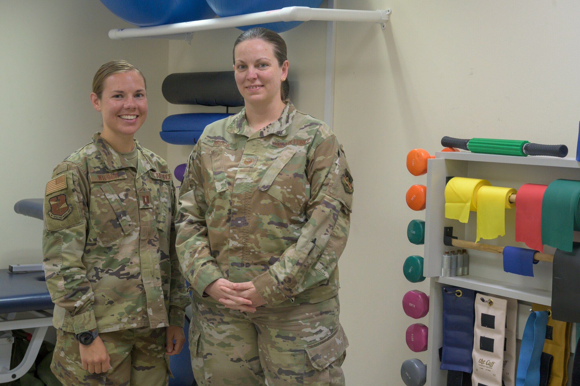 Physical therapists from the 380th Expeditionary Medical Group demonstrate common exercises used during physical therapy sessions, Al Dhafra Air Base (ADAB), United Arab Emirates, May 26, 2021. Physical therapy services are available at ADAB and include but are not limited to, therapeutic exercise, manual manipulation, and dry needling.