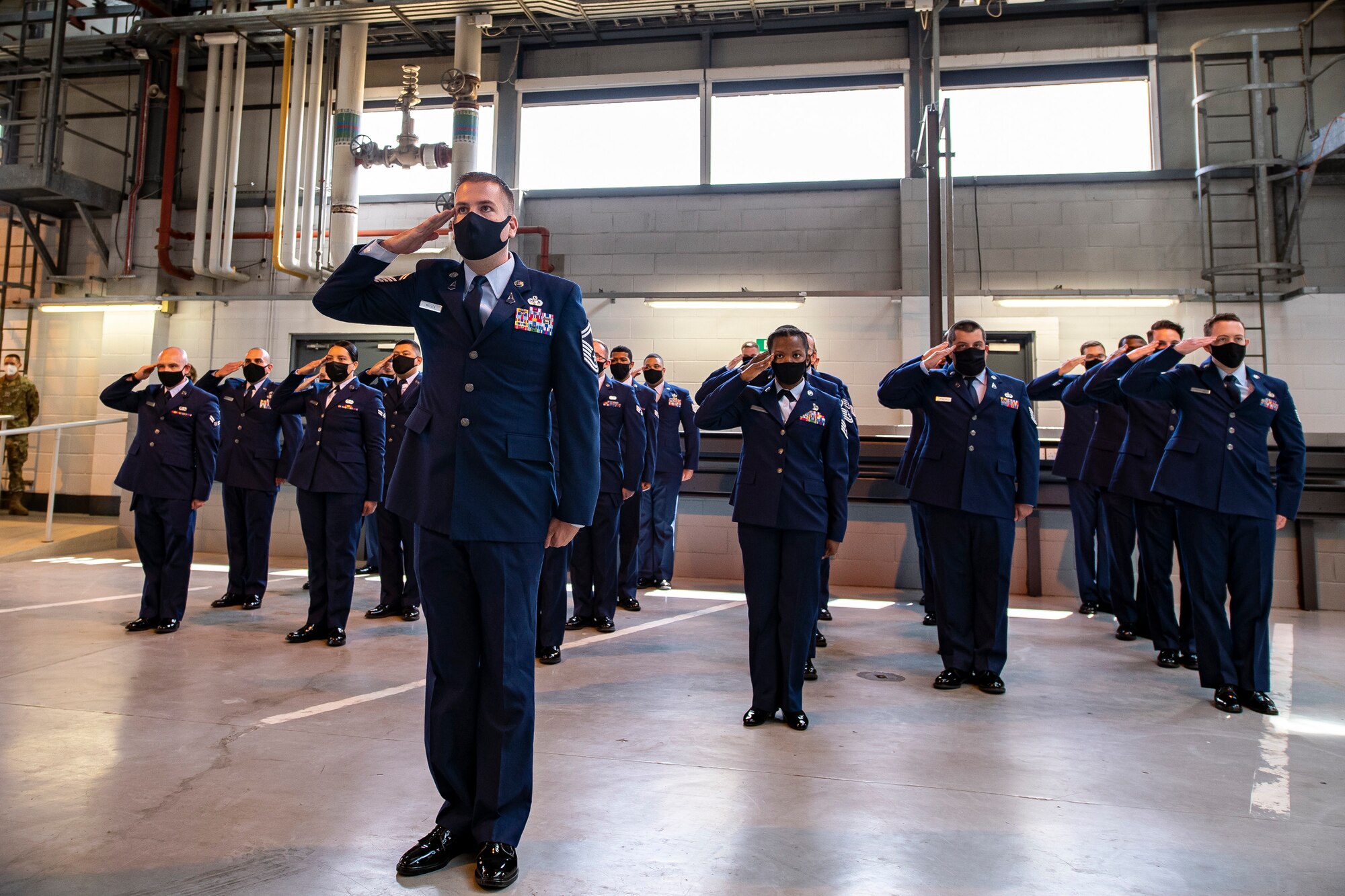 Airmen from the 423rd Communications Squadron render a final salute during a change of command ceremony at RAF Alconbury, England, June 25, 2021. During the ceremony Lt. Col. Brian Beauter, relinquished command of the 423rd CS to Maj. Erica Balfour. (U.S. Air Force photo by Senior Airman Eugene Oliver)