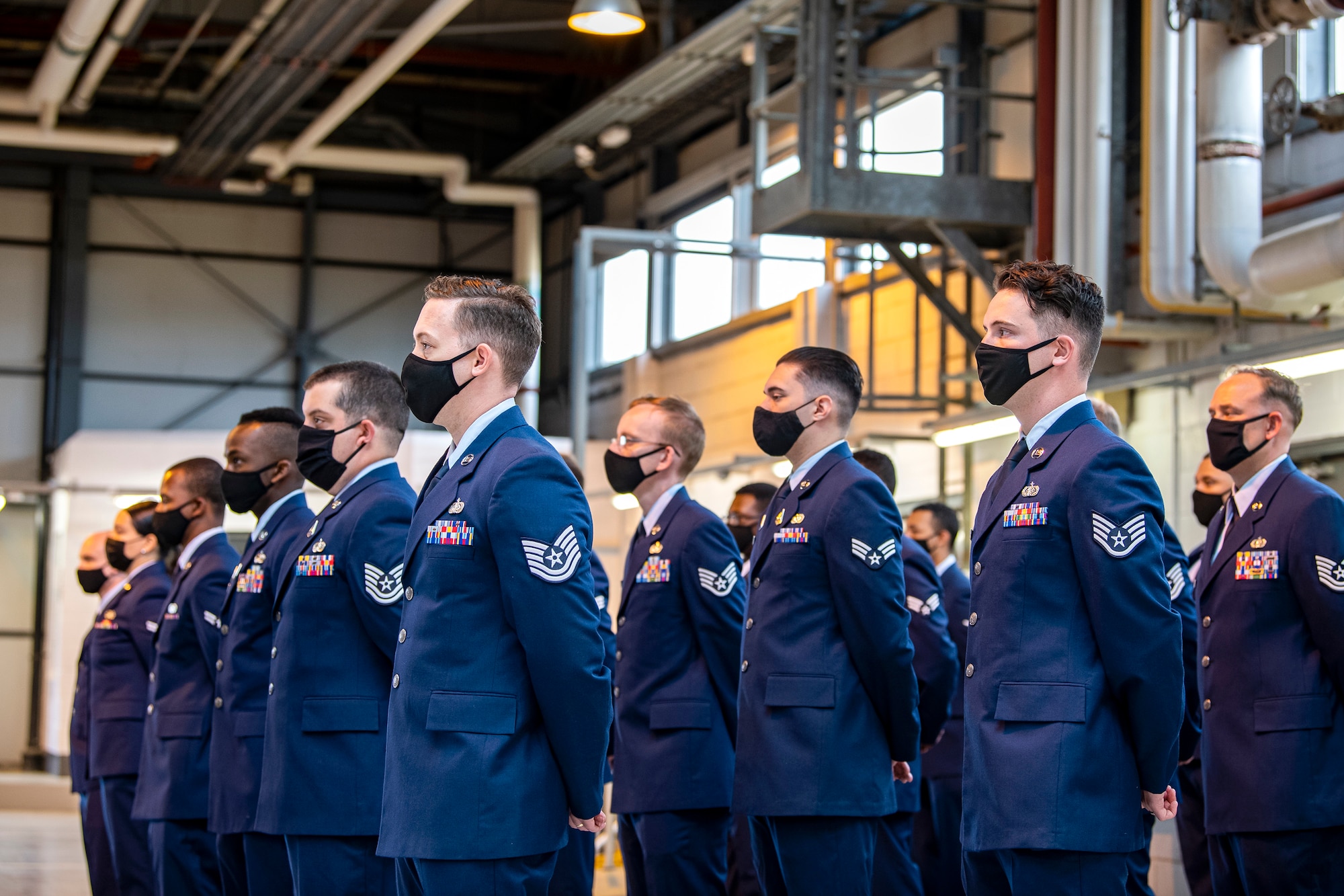 Airmen from the 423rd Communications Squadron stand at ease during a change of command ceremony at RAF Alconbury, England, June 25, 2021. During the ceremony Lt. Col. Brian Beauter, relinquished command of the 423rd CS to Maj. Erica Balfour. (U.S. Air Force photo by Senior Airman Eugene Oliver)