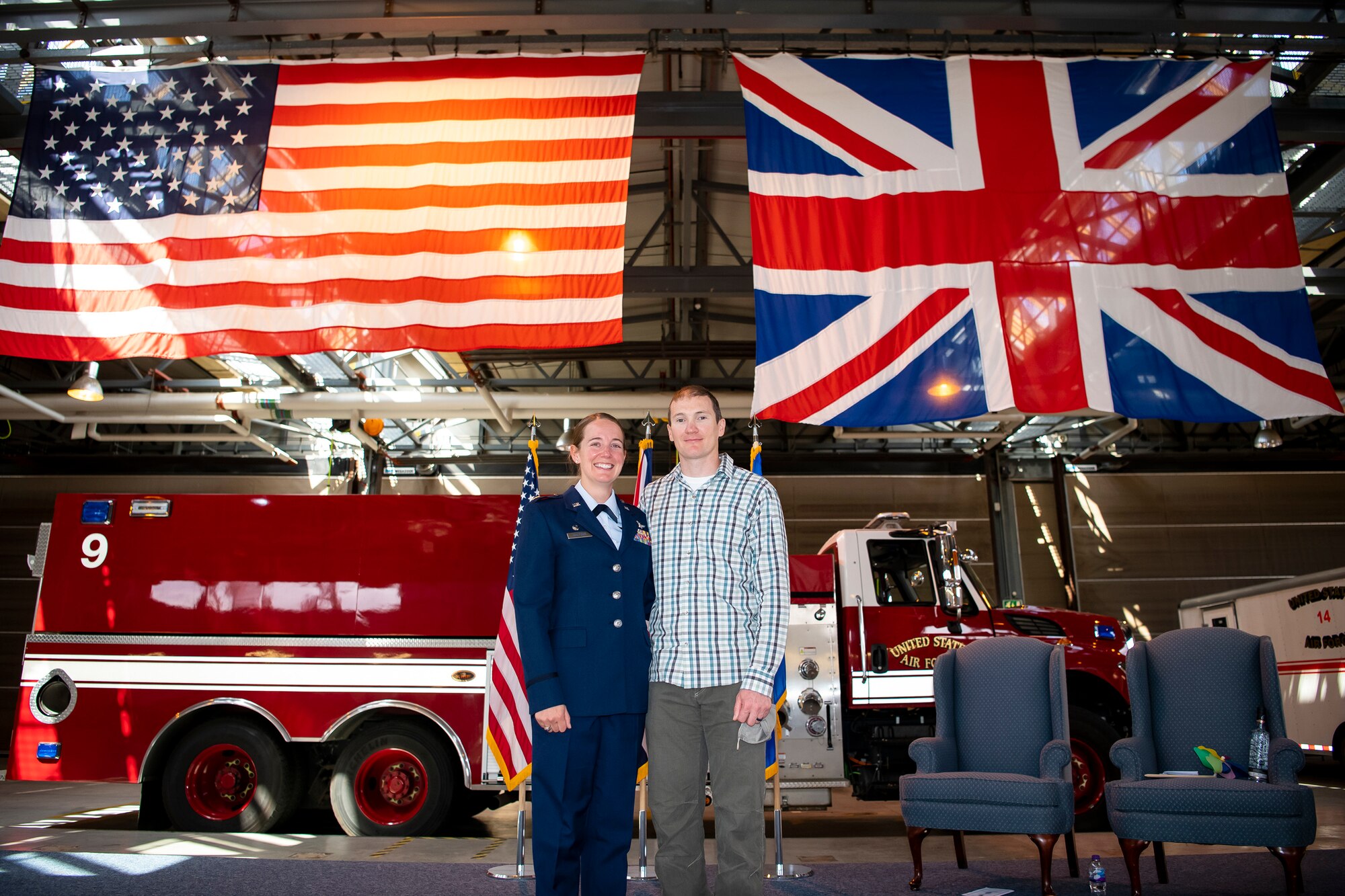 Maj. Erica Balfour, 423rd Communications Squadron incoming commander, poses for a photo with her husband after a change of command ceremony at RAF Alconbury, England, June 25, 2021. During the ceremony Lt. Col. Brian Beauter, relinquished command of the 423rd CS to Balfour. (U.S. Air Force photo by Senior Airman Eugene Oliver)