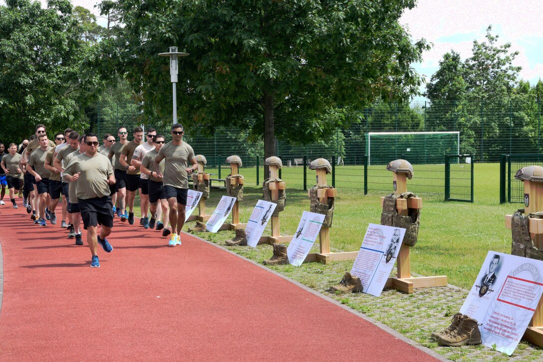 Members of the 2nd Air Support Operations Squadron run.