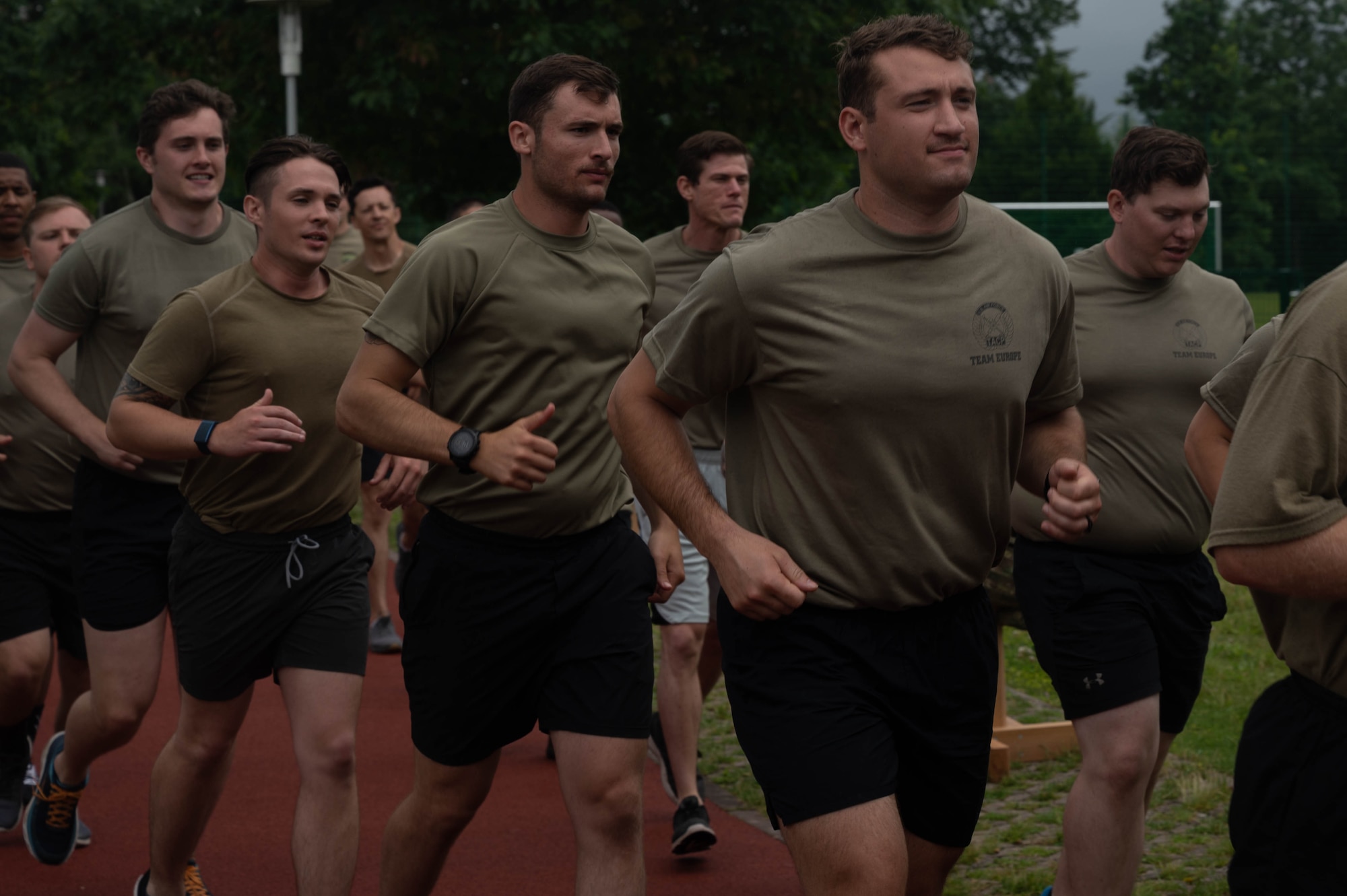 Members of the 2nd Air Support Operations Squadron run.