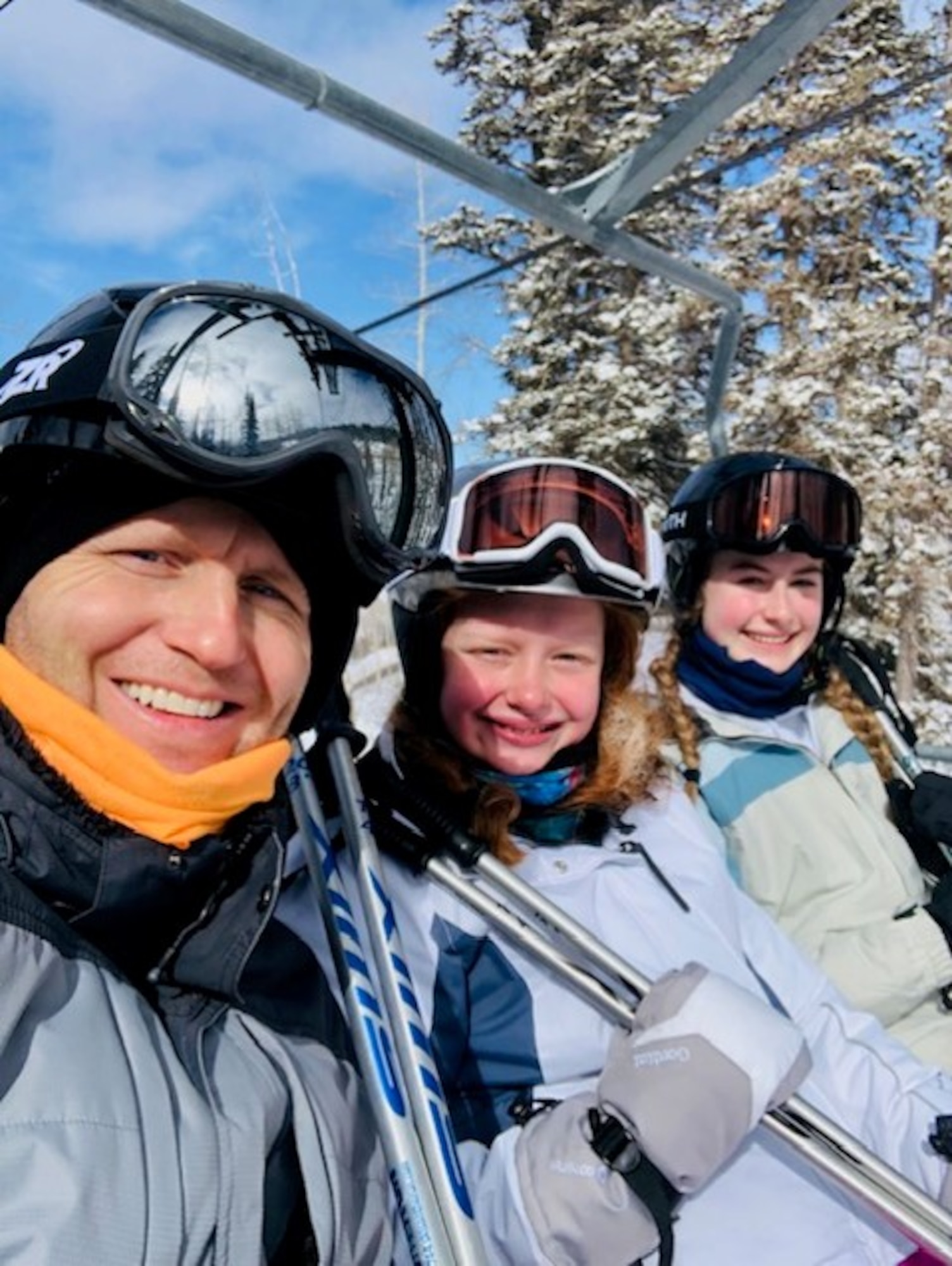 Family sitting in ski lift