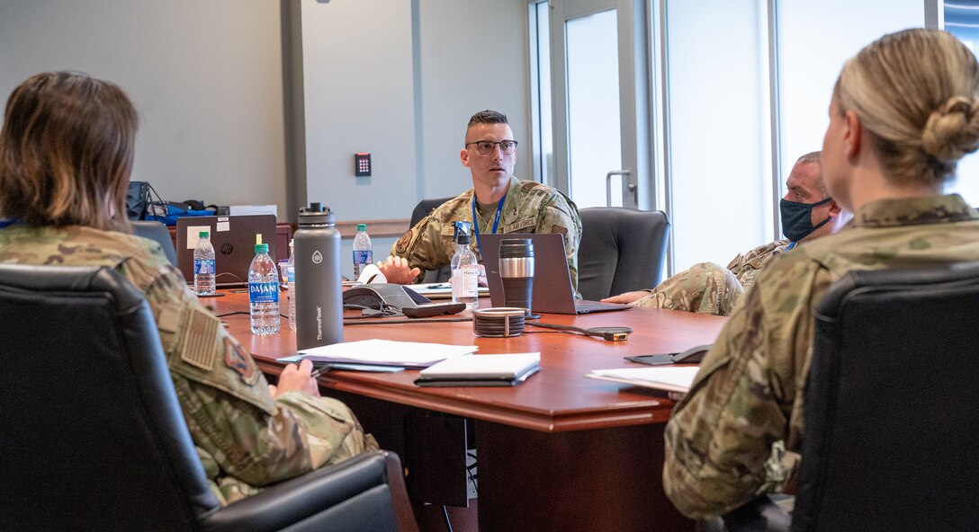 Conference participants discuss amongst themselves during the Air Force Global Strike Command Peer Influencer Conference at the Cyber Innovation Center in Bossier City, Louisiana, June 21, 2021. Victim advocates and peer influencers from installations across AFGSC came together to share ideas and best practices to tackle sexual assault prevention and response. (U.S. Air Force photo by Airman 1st Class Jonathan E. Ramos)