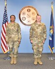 Tech. Sgt. Samara Taylor, a public affairs specialist with the 127th Wing Public Affairs office here, and Brig. Gen. Rolf E. Mammen, commander 127th Wing, stand at attention in advance of Taylor's promotion to the rank of technical sergeant here on June 5, 2021.