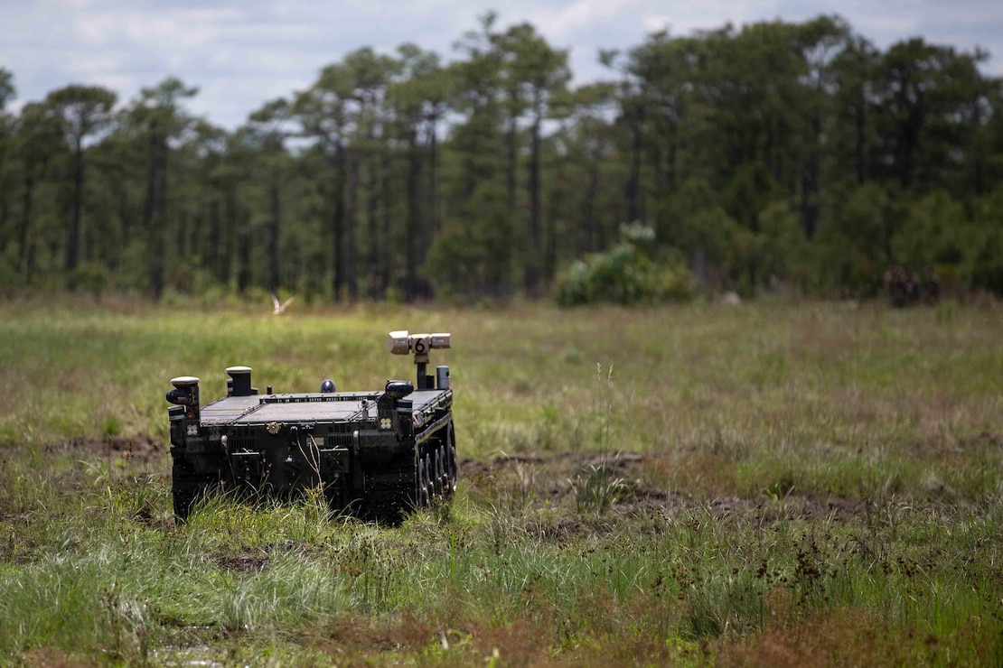 U.S. Marines with 1st Battalion, 2d Marine Regiment (1/2), 2d Marine Division, rehearse maneuvering an Expeditionary Modular Autonomous Vehicle (EMAV) during a training event on Camp Lejeune, N.C., June 24, 2021. The purpose of this training is to provide electronic warfare services to a supported unit commander. The EMAV is a highly mobile and fully autonomous ground vehicle that has a payload capacity of 7,200 pounds. (U.S. Marine Corps photo by Lance Cpl. Emma L. Gray)
