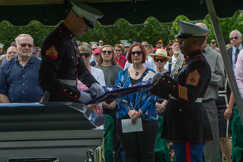 U.S. Marine Corps Cpl. Draxxon Lell (left) and U.S. Marine Gunnery Sgt. Marcus Reeves (right), both with Combat Logistics Battalion 453, 4th Marine Logistics Group, customarily fold the American flag during U.S. Marine Corps Sgt. Donald D. Stoddard’s funeral at Mountain View Memorial Park in Boulder, Colo., June 26, 2021. Stoddard died during the siege of Betio Island in November 1943 during World War II while assigned to 1st Battalion, 6th Marine Regiment, 2d Marine Division. His remains were recovered in March 2019 by the non-profit organization, History Flight. (U.S. Marine Corps photo by Cpl. Chase W. Drayer)