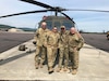 Sgt. 1st Class Michael Moy (third from left), a UH-60 helicopter repairer and crew chief with 1st Battalion, 224th Aviation Regiment, 28th Expeditionary Combat Aviation Brigade, 28th Infantry Division, poses with his fellow crew members following his final flight at Fort Indiantown Gap, Pa., on June 18, 2021. Moy, the longest serving member of the Pennsylvania National Guard with 45 years of continuous service, will retire June 30, 2021. He joined the Pa. Guard March 21, 1976, and became a military technician in 1999.  (U.S. Army National Guard courtesy photo)