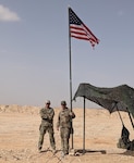 Lt Col. Matthew Wignall, battalion commander, stands with Col. Ricky Kue, battalion surgeon, both with 3rd Battalion, 172nd Infantry Regiment (Mountain), Task Force Avalanche, during a site visit in Southwest Asia. The 3-172 IN (MTN) has reached 87 percent of its deployed force being COVID-19 vaccinated. (Photo courtesy of 3-172nd Infantry (Mountain))