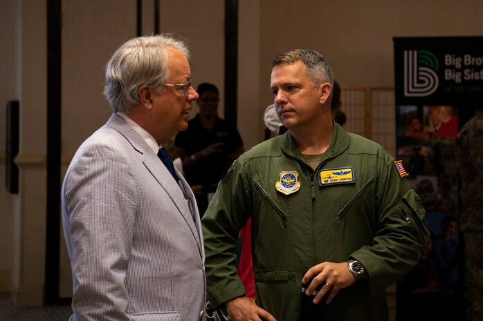 Col. Robert Lankford, the 437th Airlift Wing commander, greets John Tecklenburg, the Mayor of Charleston, at Joint Base Charleston, S.C., June 28, 2021. The 2021 Mentorship Drive was used to connect Airmen and the local community to provide mentorship opportunities helping strengthen the bond between Joint Base Charleston and its community.