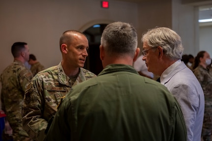 Col. Marc Green, the Joint Base Charleston commander, and Col. Robert Lankford, the 437th Airlift Wing commander, speak with John Tecklenburg, the Mayor of Charleston, at Joint Base Charleston, S.C., June 28, 2021. The 2021 Mentorship Drive was used to connect Airmen and the local community to provide mentorship opportunities helping strengthen the bond between Joint Base Charleston and its community.