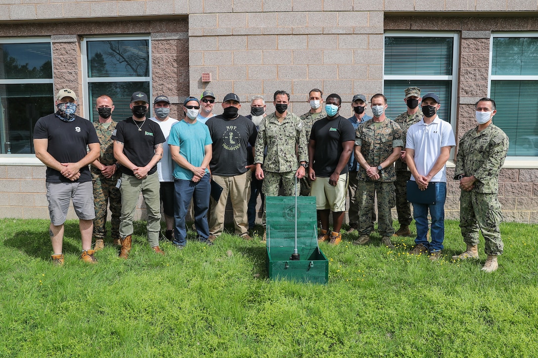 Members of EXU-1, MARDET and NSWC IHD's Energetics Manufacturing Department pose for a photo.
