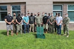 Members of EXU-1, MARDET and NSWC IHD's Energetics Manufacturing Department pose for a photo.