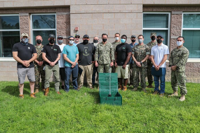 Members of EXU-1, MARDET and NSWC IHD's Energetics Manufacturing Department pose for a photo.