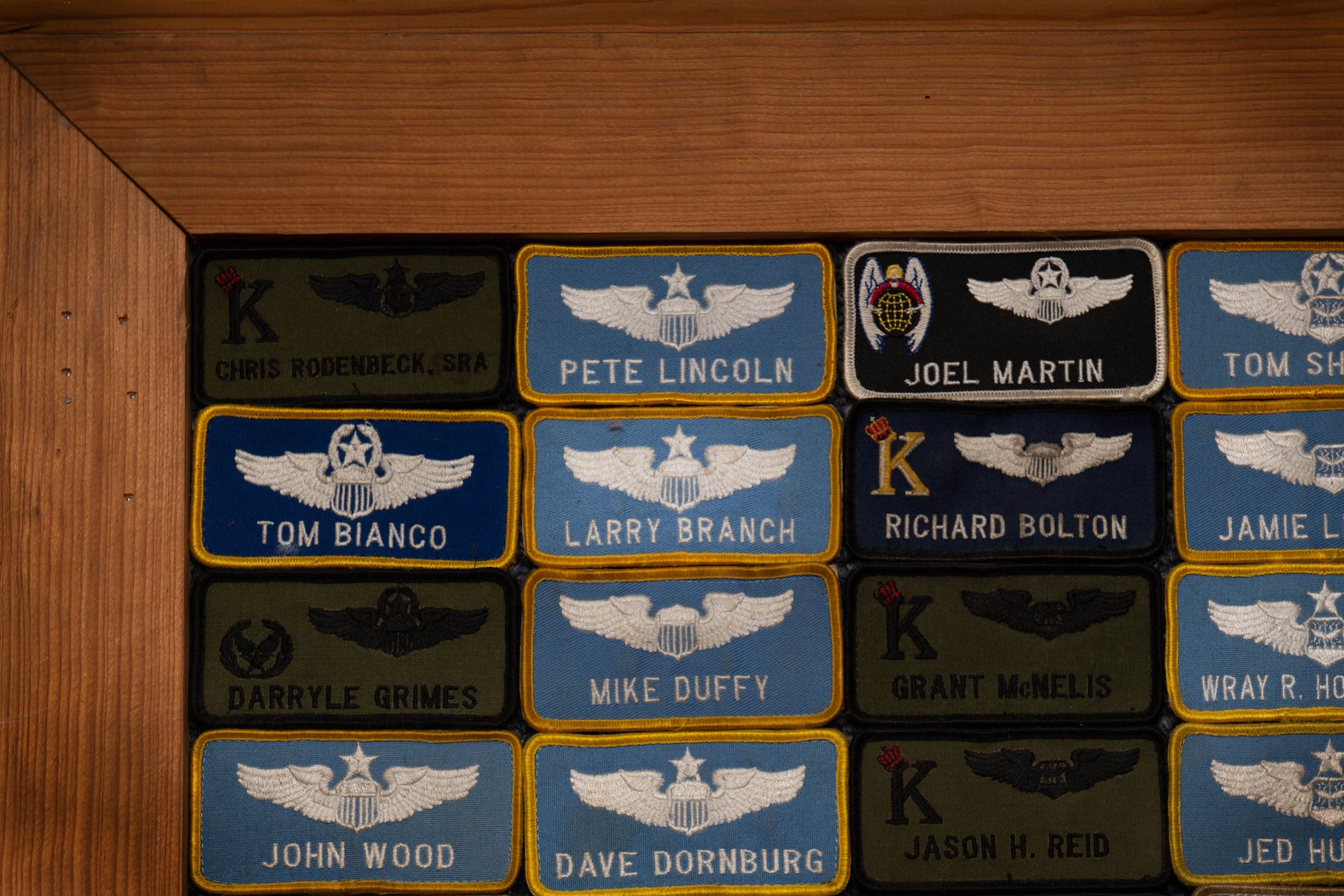A board with name tapes attached to it with the center one reading Larry Branch
