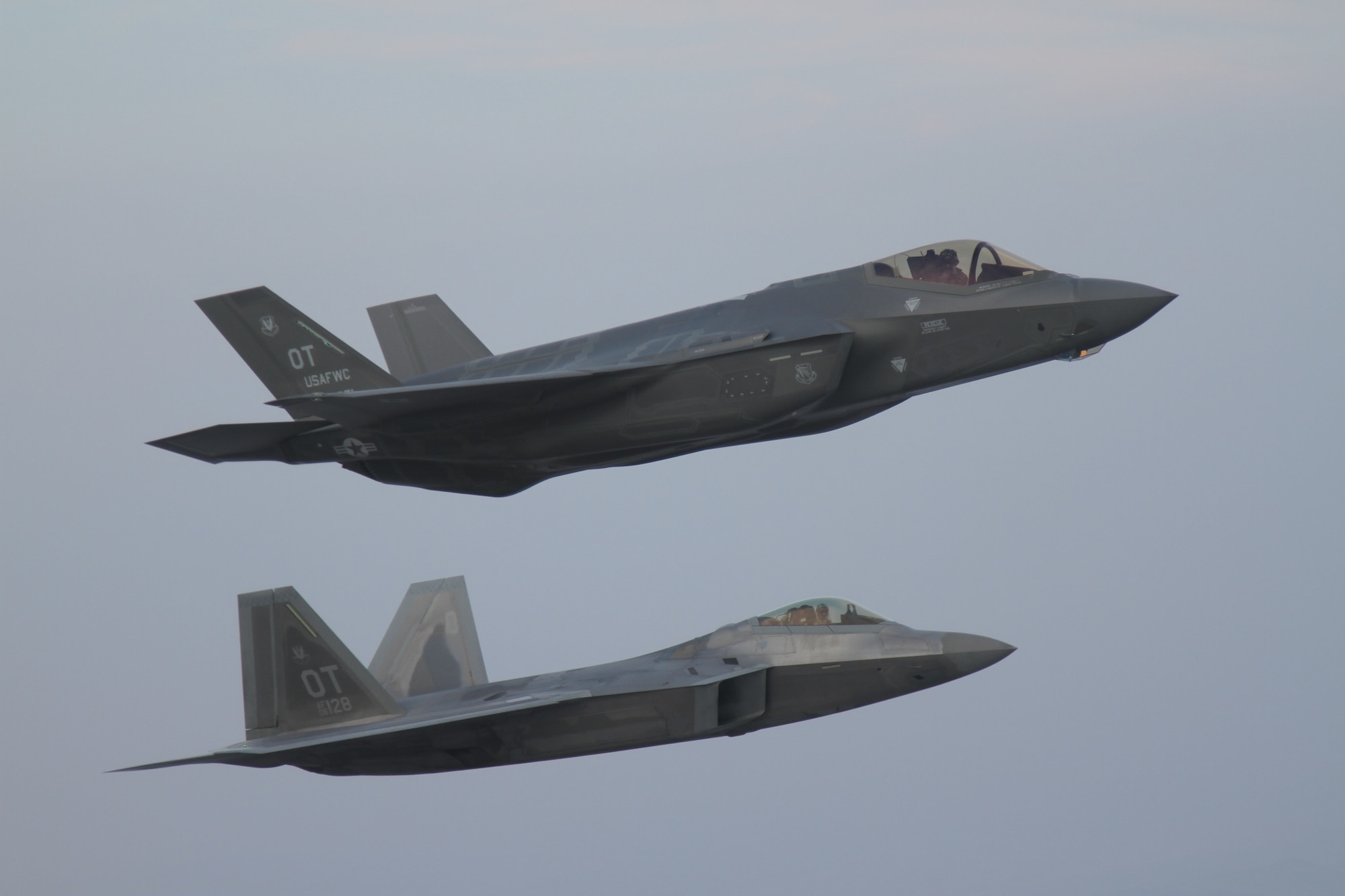 An F-35 A flies with an F-22 to test interoperability between the two aircraft platforms. (U.S. Air Force photo)