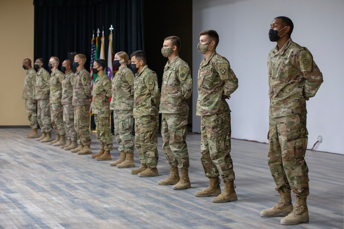 The U.S. Army Central 2021 Best Warrior Competition competitors stand for recognition during the recognition ceremony at Camp Arifjan, Kuwait, June 24, 2021. The event culminated in three days of various activities, ranging from an obstacle course to a written essay about Army doctrine. (U.S. Army photo by Spc. Maximilian Huth, U.S. Army Central Public Affairs)