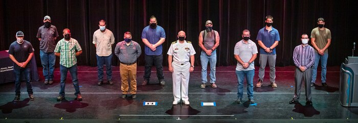 Capt. Jip Mosman, commander, Puget Sound Naval Shipyard & Intermediate Maintenance Facility, poses for a photo with some of the 31 2020 Employee of the Year award winners June 28, 2021, during an awards ceremony at the historic Admiral Theater in Bremerton, Washington. (PSNS & IMF photo by Scott Hansen)