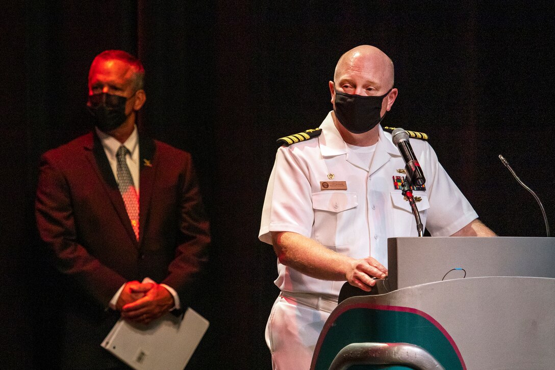 Capt. Jip Mosman, commander, Puget Sound Naval Shipyard & Intermediate Maintenance Facility, congratulates some of the 221 nominees for 2020 Employee of the Year during an award ceremony June 28, 2021, at the historic Admiral Theater in Bremerton, Washington. (PSNS & IMF photo by Scott Hansen)