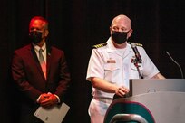 Capt. Jip Mosman, commander, Puget Sound Naval Shipyard & Intermediate Maintenance Facility, congratulates some of the 221 nominees for 2020 Employee of the Year during an award ceremony June 28, 2021, at the historic Admiral Theater in Bremerton, Washington. (PSNS & IMF photo by Scott Hansen)