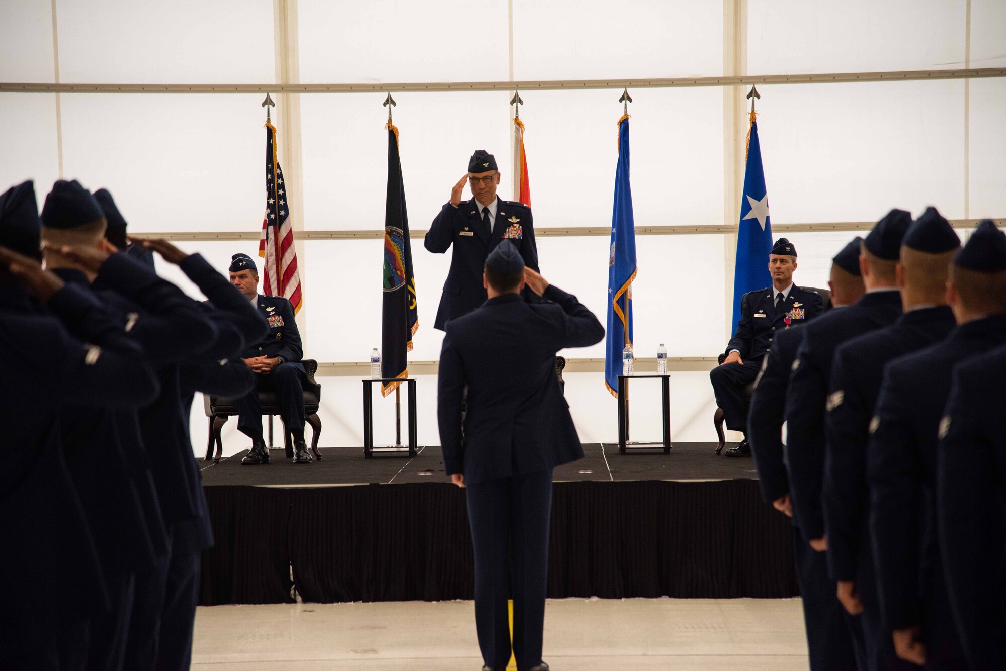 Col. George Vogel, 22nd Air Refueling Wing inbound commander, renders his first salute to Airmen of the 22nd Air Refueling Wing June 28, 2021, at McConnell Air Force Base, Kansas. The change of command ceremony is a military tradition that represents the transfer of authority and responsibility of a unit. (U.S. Air Force Photo by Airman 1st Class Zachary Willis)