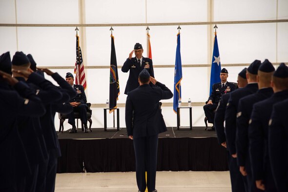 Maj. Gen. Kenneth Bibb, 18th Air Force commander, presents the ceremonial guidon to Col. George Vogel, 22nd Air Refueling Wing inbound commander, June 28, 2021, at McConnell Air Force Base, Kansas. Vogel was previously stationed at Kadena Air Base, Japan, where he served as the wing vice commander. (U.S. Air Force Photo by Airman 1st Class Zachary Willis)