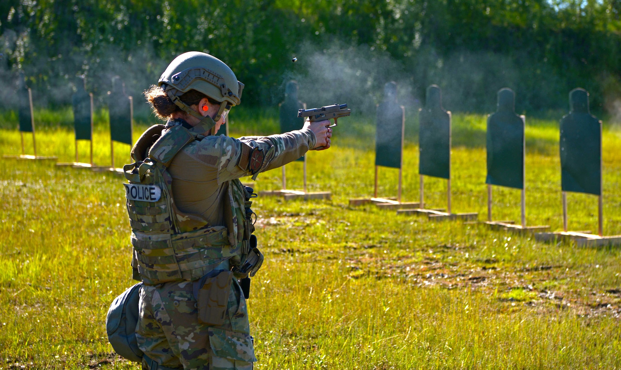 U.S. Air Force Airman 1st Class Alex Soto, a 354th Security Forces Squadron installation entry controller fires her weapon at a target during special weapons and tactics (SWAT) training June 23, 2021 on Eielson Air Force Base, Alaska. SWAT team members are required to be proficient marksmen to prevent mistakes in chaotic situations, such as an active shooter scenario. (U.S. Air Force photo by Senior Airman Beaux Hebert)