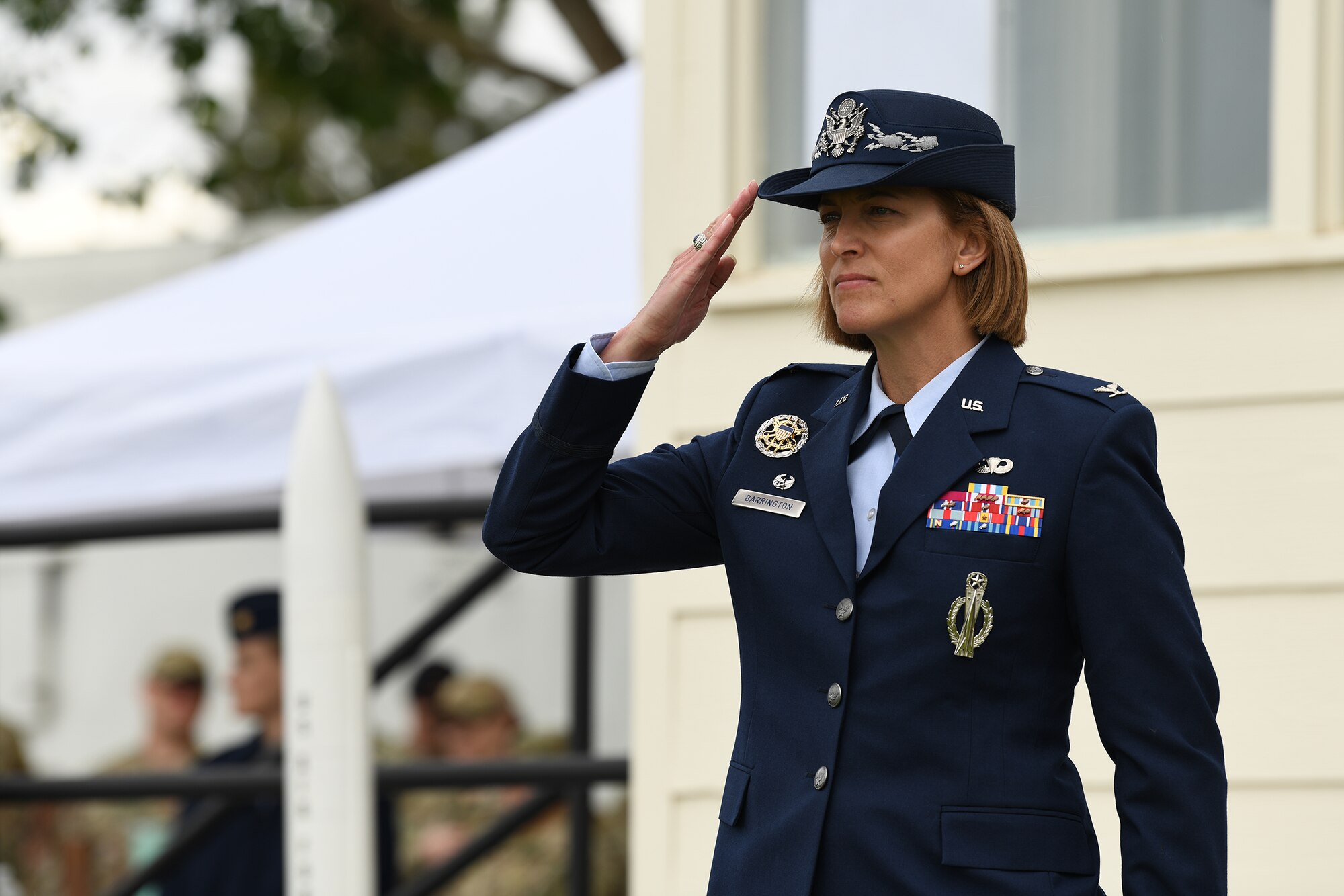 Col. Catherine Barrington, 90th Missile Wing commander, renders her first salute during the 90 MW change of command ceremony June 28, 2021, F.E. Warren Air Force Base, Wyoming. The ceremony signified the transition of command from Col. Peter Bonetti to Col. Catherine Barrington. (U.S. Air Force photo by Airman 1st Class Anthony Munoz)