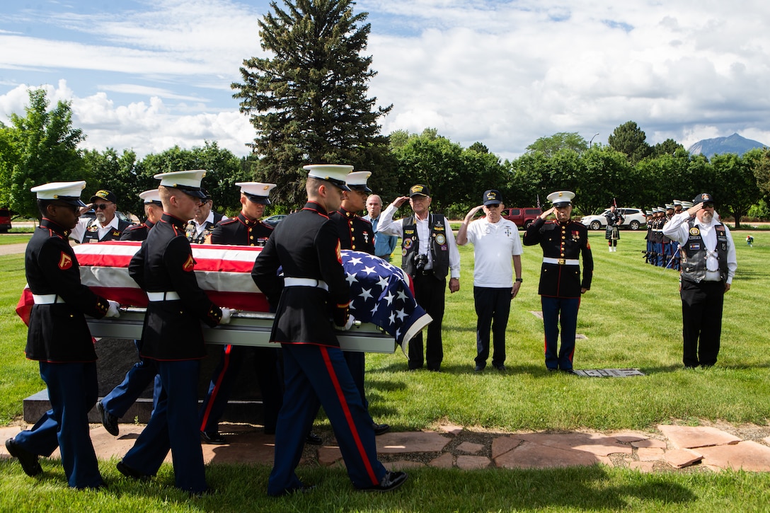 U.S. Marines with Combat Logistics Battalion 453, 4th Marine Logistics Group, transfer a casket containing the remains of U.S. Marine Corps Sgt. Donald D. Stoddard to the burial site at Mountain View Memorial Park in Boulder, Colo., June 26, 2021. Stoddard died during the siege of Betio Island in November 1943 during World War II while assigned to 1st Battalion, 6th Marine Regiment, 2d Marine Division. His remains were recovered in March 2019 by the non-profit organization, History Flight.