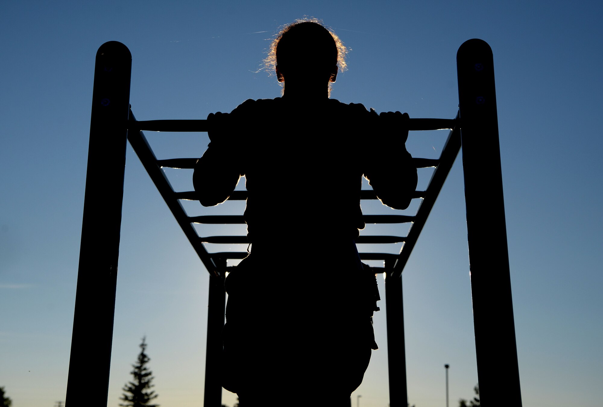 U.S. Air Force Airman 1st Class Alexandranell Soto, a 354th Security Force Squadron response force leader completes a pull-up during a special weapons and tactics (SWAT) physical training test June 23, 2021 on Eielson Air Force Base, Alaska. The defenders conducted multiple exercises to ensure they are physically fit and capable of completing the SWAT training. (U.S. Air Force photo by Senior Airman Beaux Hebert)