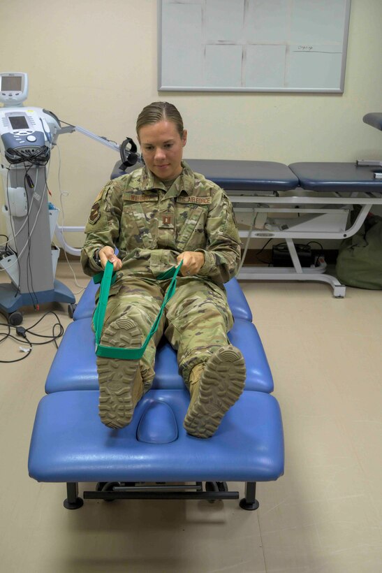 Physical therapists from the 380th Expeditionary Medical Group demonstrate common exercises used during physical therapy sessions, Al Dhafra Air Base (ADAB), United Arab Emirates, May 26, 2021. Physical therapy services are available at ADAB and include but are not limited to, therapeutic exercise, manual manipulation, and dry needling.