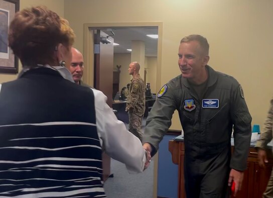 photo of Gen. Cunningham shaking hands with female civic leader