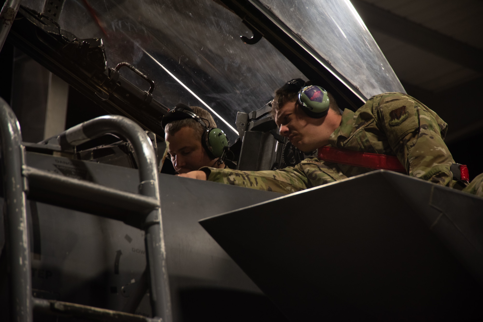 Two Airmen inspect the Radar Warning Receiver