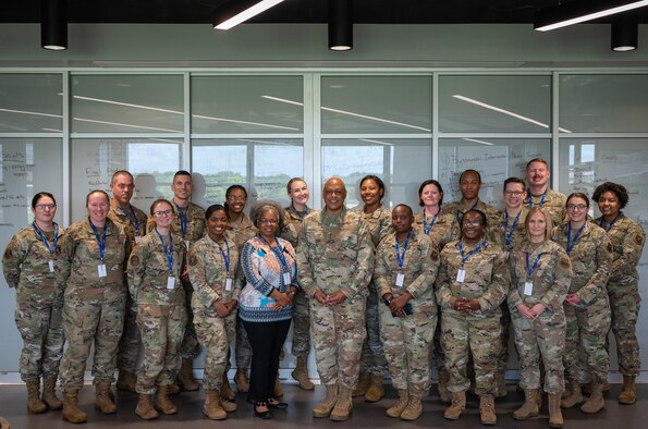 Lt. Gen. Anthony Cotton, Air Force Global Strike Command deputy commander, poses for a group photo with conference participants during the AFGSC Peer Influencer Conference at the Cyber Innovation Center in Bossier City, Louisiana, June 21, 2021. Victim advocates and peer influencers from installations across AFGSC came together to share ideas and best practices to tackle sexual assault prevention and response. (U.S. Air Force photo by Airman 1st Class Jonathan E. Ramos)