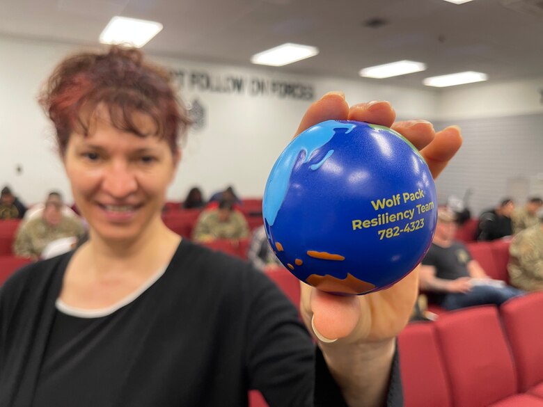 Ms. Neli Meier, 8th Fighter Wing community support coordinator, poses with Resiliency Week stress ball during a resiliency training class on June 23, 2021, Kunsan Air Base, Republic of Korea. Multiple base organizations came together between June 20 to 25 to run Kunsan’s Resiliency Week. U.S.  Airmen and Soldiers stationed here participated in activities from promoting and healthy habits informing members on the many base programs designed for overcoming resiliency challenges. (U.S. Air Force photo by Tech Sgt. James Cason)