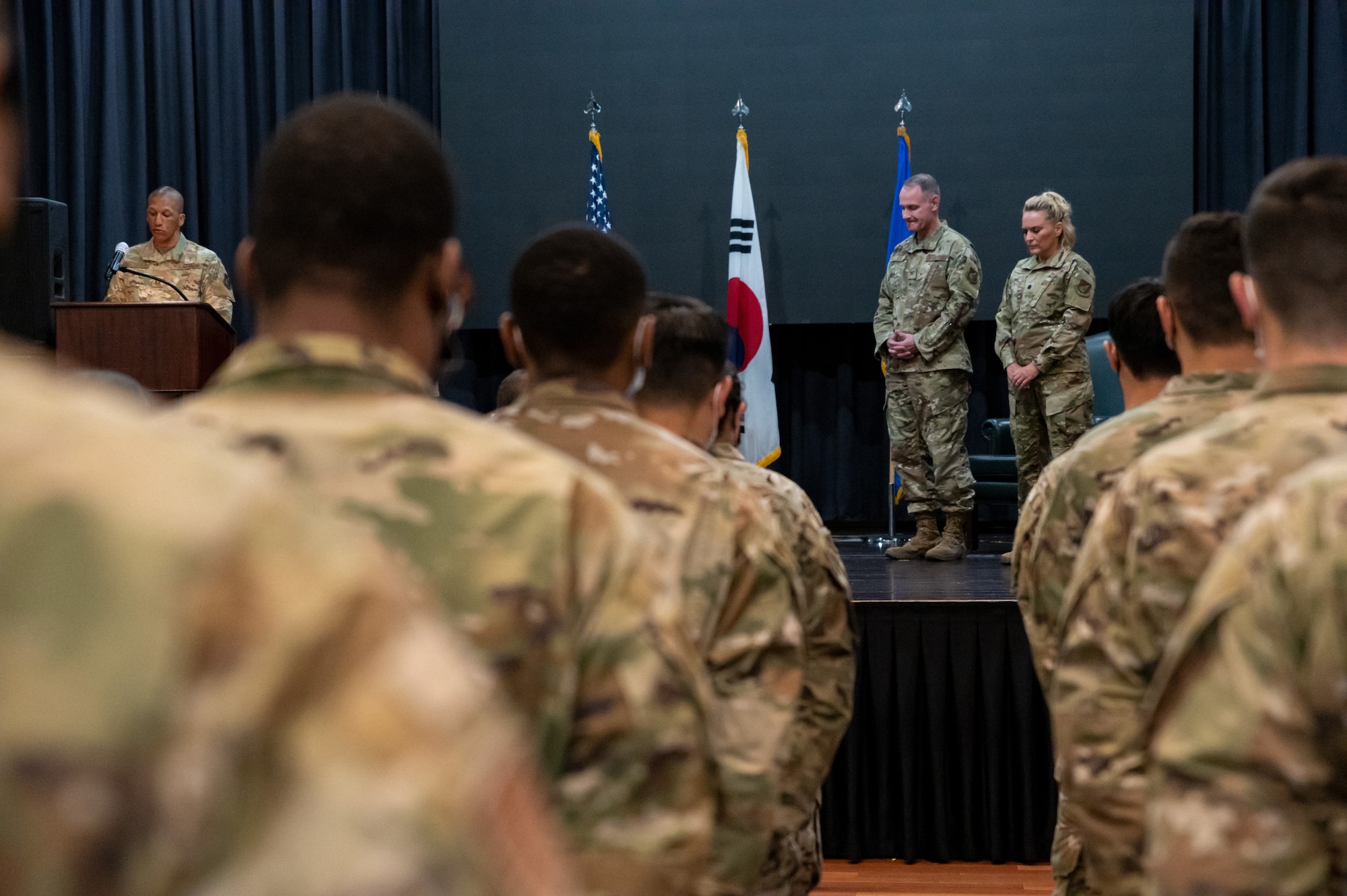 Chaplain Christopher Crutchfield, left, performs an invocation at the 51st Operational Medical Readiness Squadron assumption of command at Osan Air Base, Republic of Korea, June 29, 2021. The change of command ceremony is deeply rooted in military tradition that dates back to the reign of King Frederick of Prussia and has persisted into modern day. (U.S. Air Force photo by Tech. Sgt. Nicholas Alder)