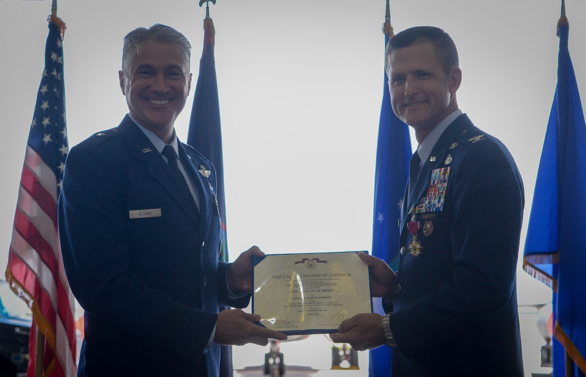 U.S. Air Force Col. Jasin Colley, 36th Mission Support Group outgoing commander, is awarded the Legion of Merit from U.S. Air Force Brig. Gen. Jeremy Sloane, 36th Wing commander, during a change of command ceremony at Andersen Air Force Base, Guam, June 29, 2021.