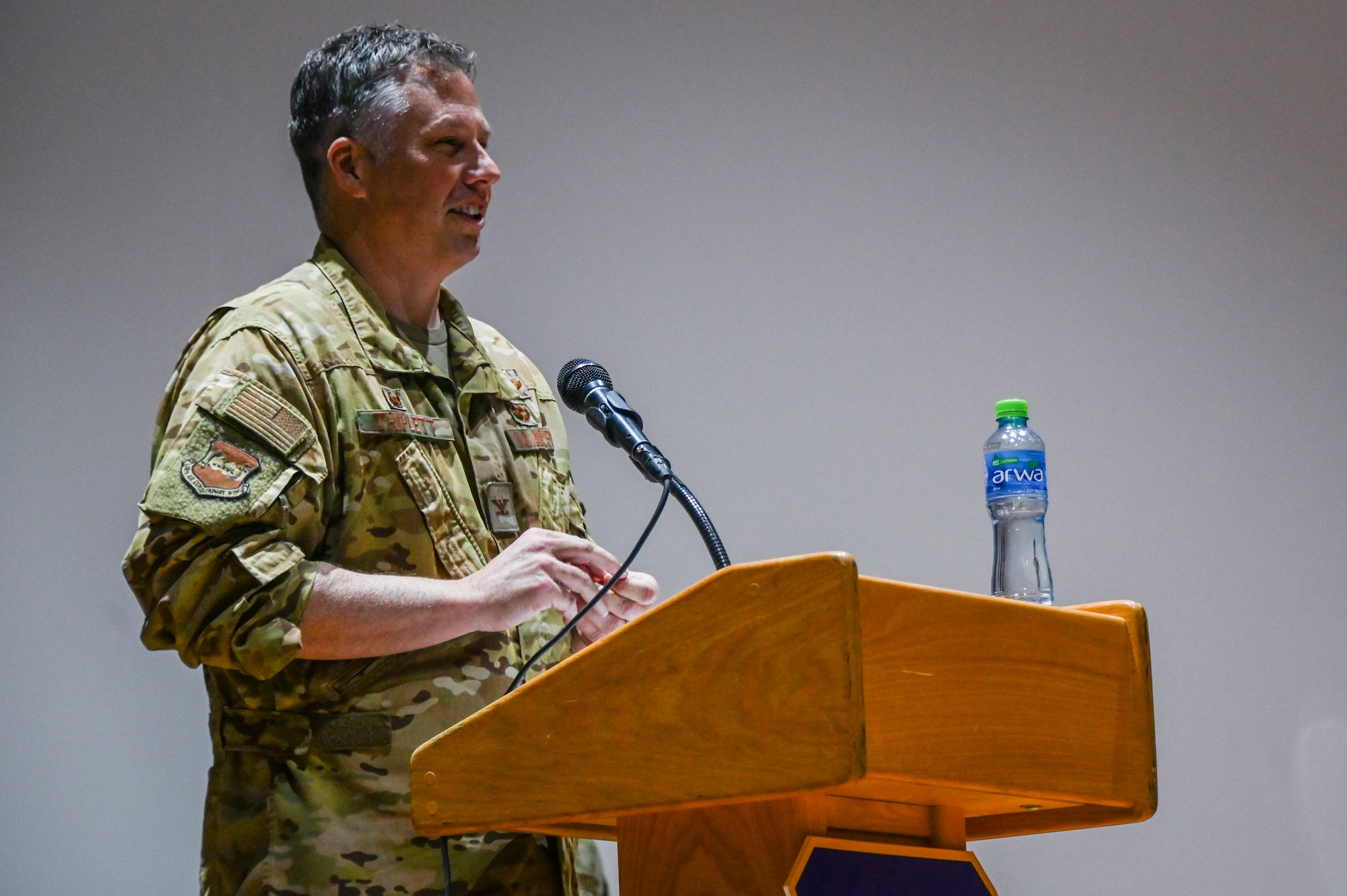 A photo of a commander speaking at a ceremony