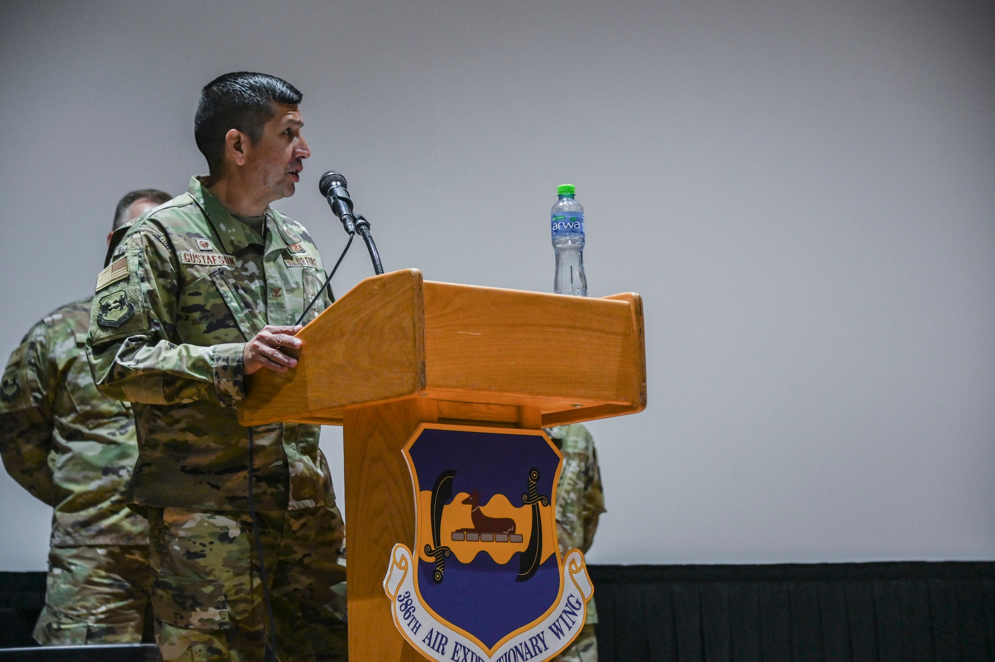 A photo of a commander speaking at a ceremony