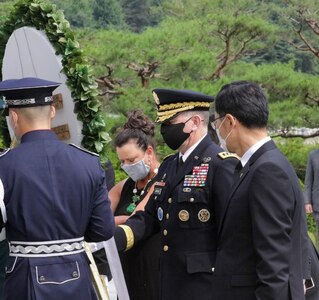 Gen. Robert B. "Abe" Abrams and his wife Connie Abrams lay a wreath for fallen and missing soldiers at the Seoul National Cemetery in Seoul.