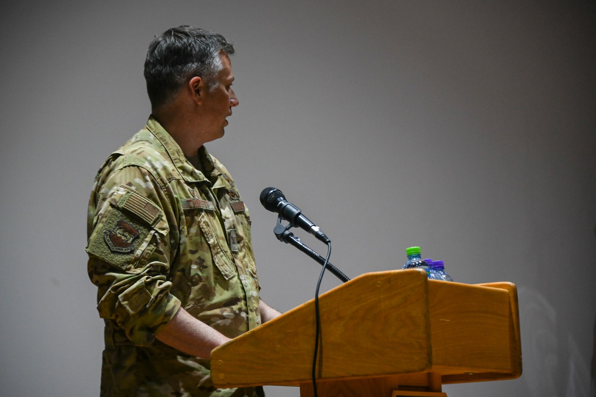 A photo of a commander speaking at a ceremony