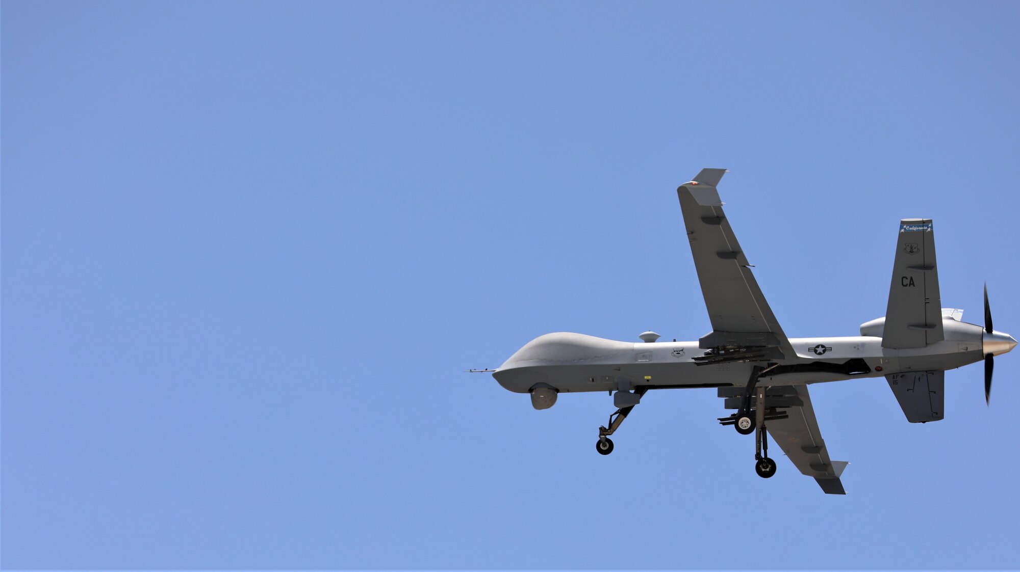 California Air National Guard’s 163d Attack Wing MQ-9 Reaper remotely piloted aircraft takes off from a runway at March Air Reserve Base in Moreno Valley, California before mapping a controlled fire, June 9, 2021. (U.S. Army National Guard illustration by Sgt. 1st Class Amanda H. Johnson)