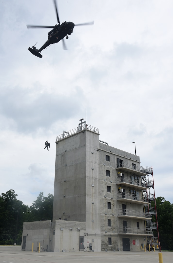 Virginia National Guard aviation crews and Chesterfield County Fire and Emergency Medical Services Scuba Rescue Team members train on confined-space rescue hoist operations June 10, 2021, in Chesterfield County, Virginia.