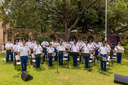 The 323d Army Band poses for a group photo at the Alamo.