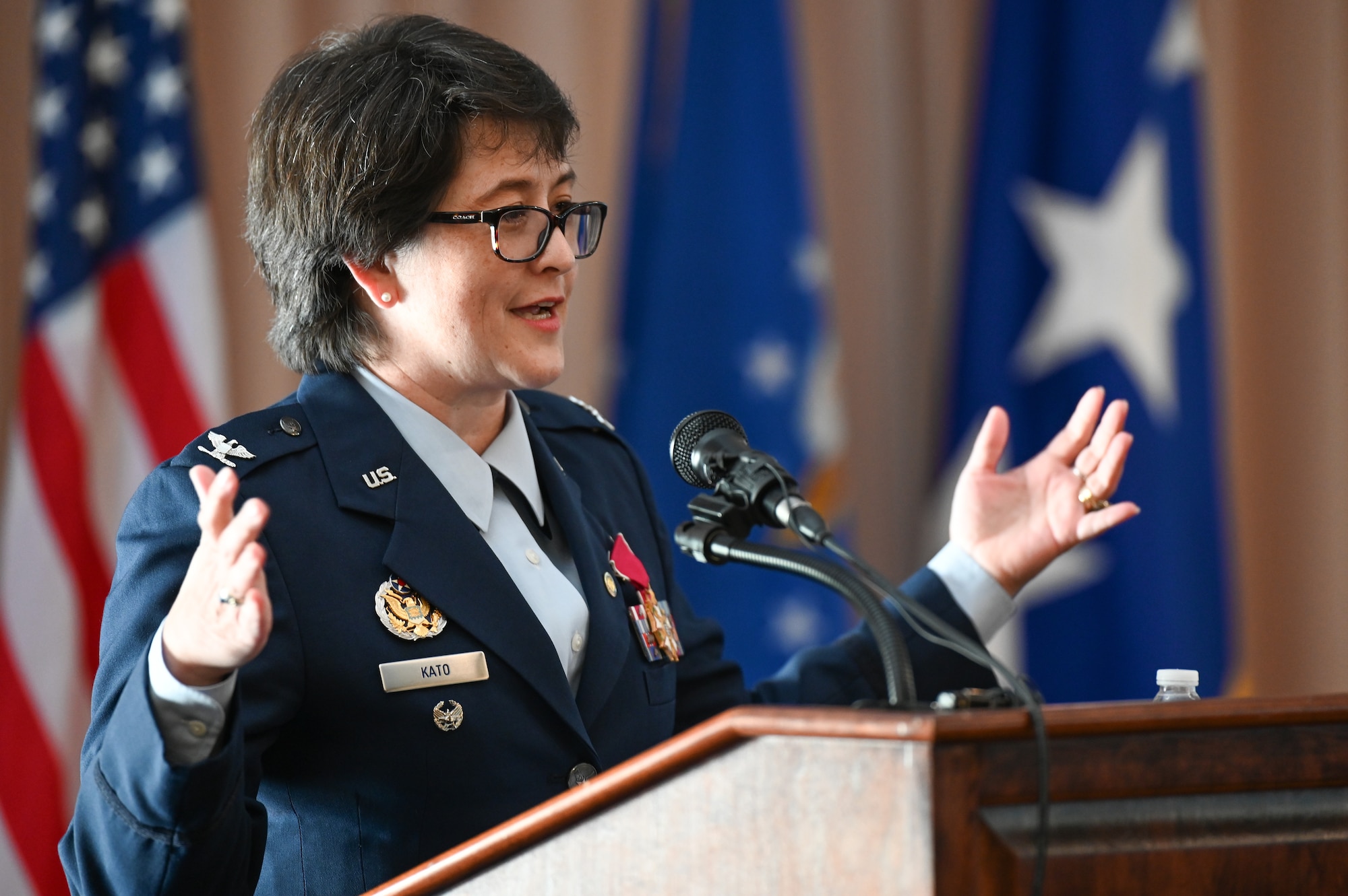 Col. Amanda G. Kato comments on highlights of her career during a retirement ceremony honoring her more than 29 years of service in the Air Force on June 18, 2021, at Hanscom Air Force Base, Massachusetts. She is the Air Force program executive officer for nuclear command, control and communications (NC3), as well as the director of NC3 integration for the Air Force Nuclear Weapons Center. (U.S. Air Force photo by Todd Maki)