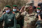 U.S. Army Maj. Gen. Michael Turley, adjutant general, Utah National Guard, salutes U.S. and Moroccan Armed Forces members during a key leader engagement as part of African Lion 2021 June 16, 2021, at the Military Medical Surgical Field Hospital in Tafraoute, Morocco. Utah and Morocco are partners under the State Partnership Program.