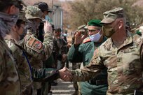 U.S. Army Maj. Gen. Michael Turley, Adjutant General Utah National Guard, shakes hands with a Royal Moroccan Armed Forces member during a key leader engagement as part of African Lion 2021 June 16, 2021, at the Military Medical Surgical Field Hospital in Tafraoute, Morocco