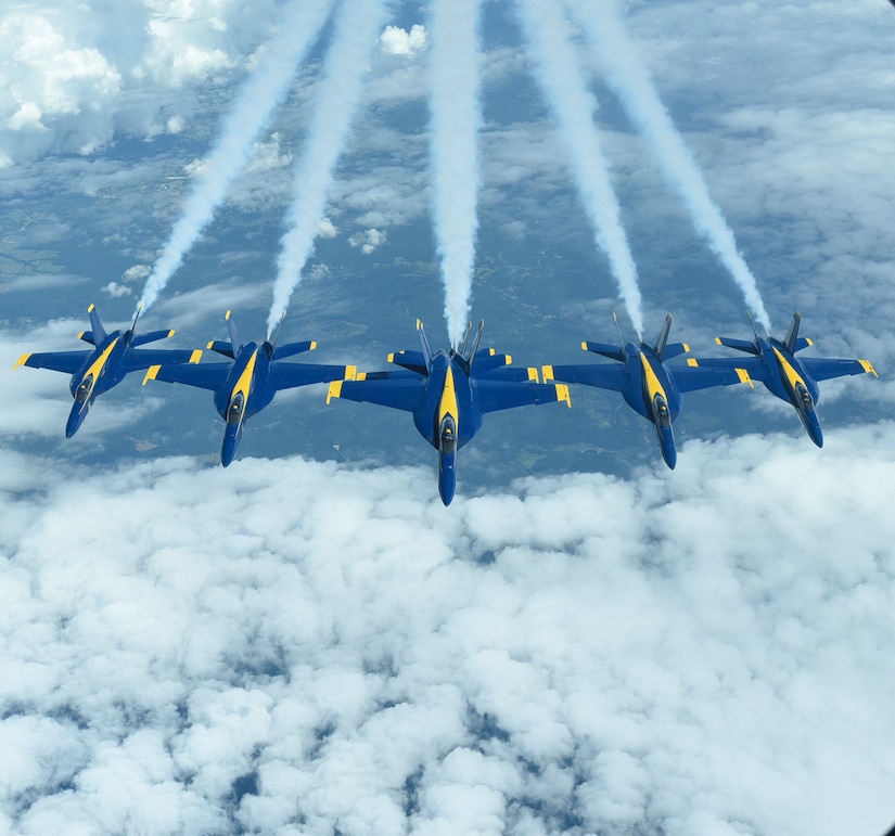 Six U.S. Navy Blue Angels F/A-18 Hornets fly in formation behind a KC-10 Extender assigned to the 305th Air Mobility Wing on Joint Base McGuire-Dix-Lakehurst, N.J., June 28, 2021. The Blue Angels needed in-flight refueling during their flight home to Florida after participating in an Air Show. (U.S. Air Force photo by Senior Airman Ariel Owings)